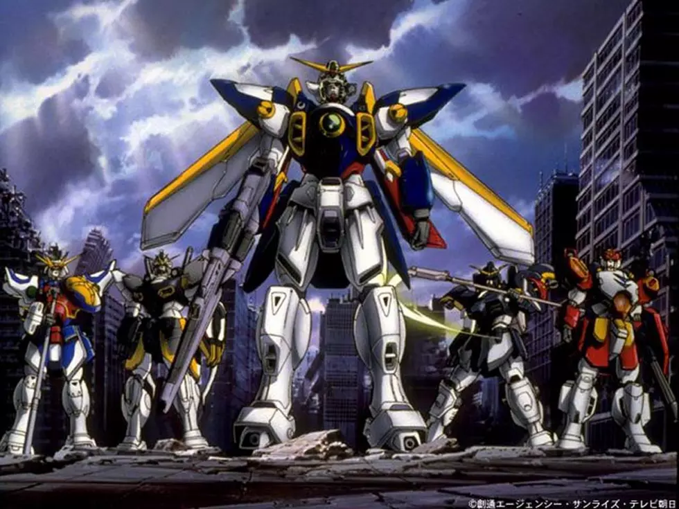 L to R: Shenlong Gundam, Sandrock Gundam, Wing Gundam, Deathscythe Gundam & Heavyarms Gundam.